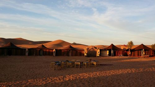 Houses on beach against sky