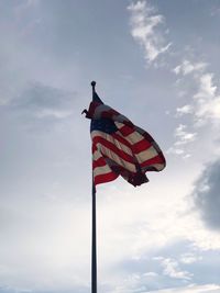 Low angle view of flag against sky