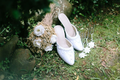 High angle view of shoes on grassy field