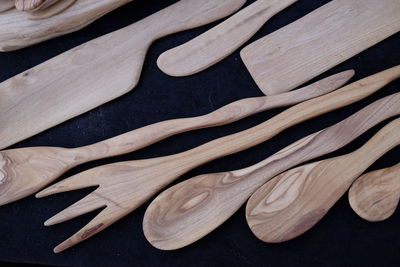High angle view of wooden utensils on table