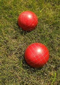 Close-up of red ball on grassy field