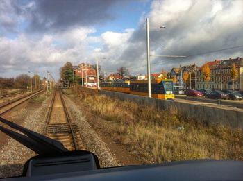 View of railroad tracks against cloudy sky