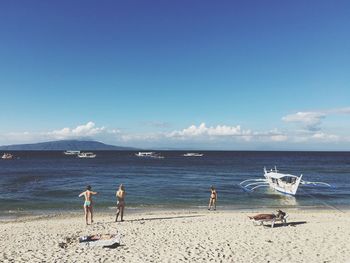 Scenic view of sea against blue sky