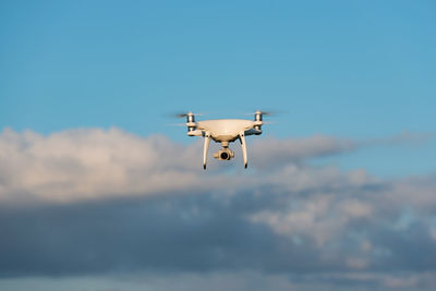Low angle view of drone against sky