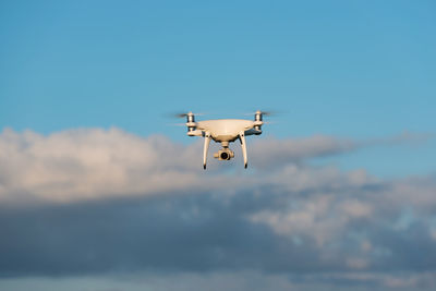 Low angle view of airplane flying in sky