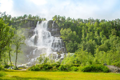 Falls in mountains of norway in rainy weather. waterfall. tvindefossen waterfall near voss, norway.