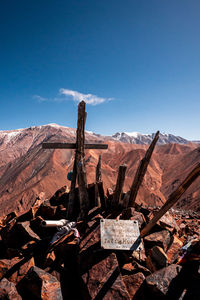 Scenic view of mountains against clear blue sky