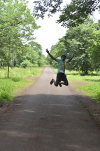 Boy playing on road