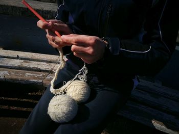 Close-up of man working on wood