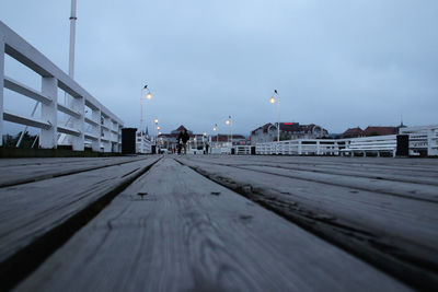 Surface level of street against sky in city