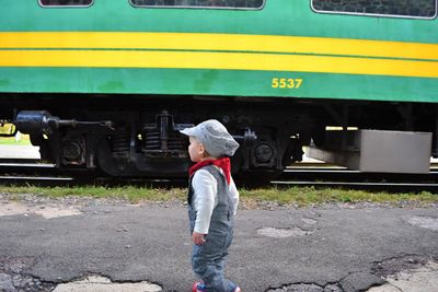 Cute boy looking at train