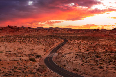 Scenic view of land against sky during sunset