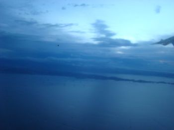 Scenic view of landscape against cloudy sky