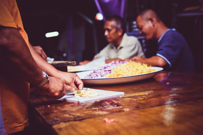 Group of people preparing the food for gathering 