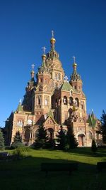 Low angle view of st petersburg church against blue sky