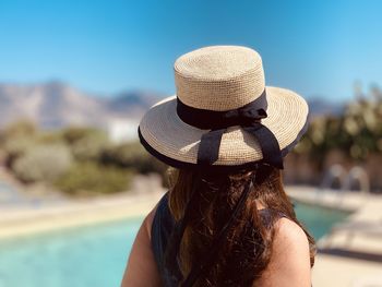 Rear view of woman wearing hat in standing outdoors