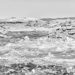 Scenic view of arid landscape against clear sky