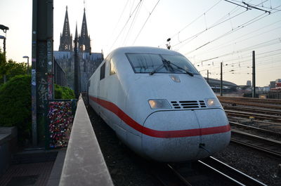 Train on railroad station platform against clear sky