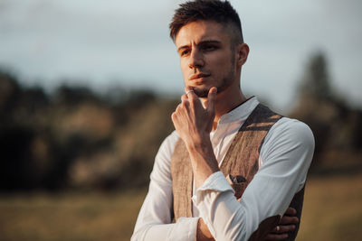 Portrait of young man looking away