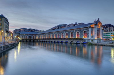 Batiment des forces-motrices and rhone river by night, geneva, switzerland, hdr