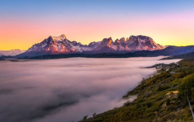 Scenic view of mountains against sky during sunset