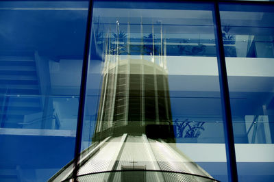 Reflection of building on glass window