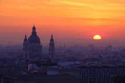 Cityscape against sky during sunset