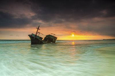 Scenic view of sea against sky during sunset