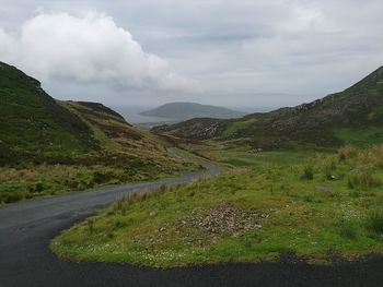 Country road leading towards mountains