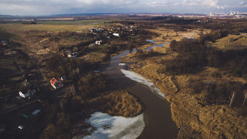 Scenic view of river amidst landscape against sky