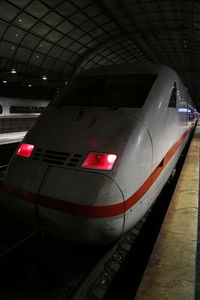 Car in illuminated underground walkway