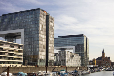 Modern buildings in city against sky