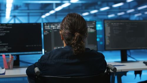Rear view of woman standing in music