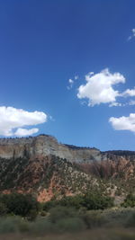 Scenic view of mountains against cloudy sky