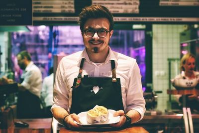 Portrait of young man with ice cream