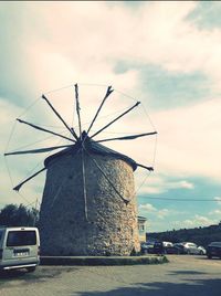 Traditional windmill against sky