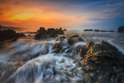 Scenic view of sea against sky during sunset