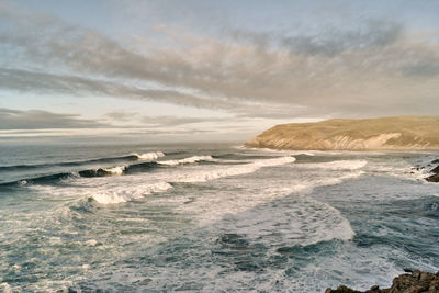 Scenic view of beach against sky