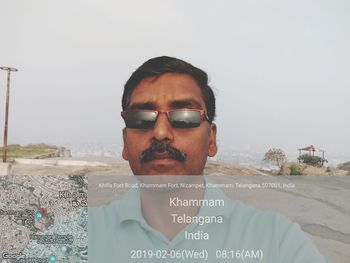 Portrait of young man against clear sky