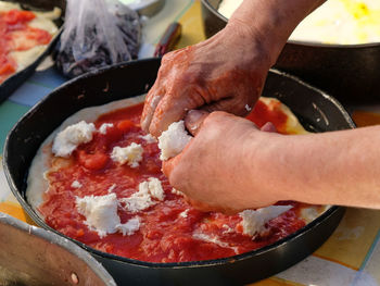 Woman hands preparing homemade tasty italian pizza, cilento cooking 