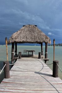 Pier over sea against sky