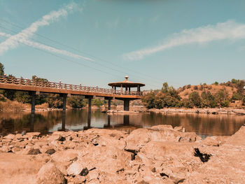 Bridge over river against sky