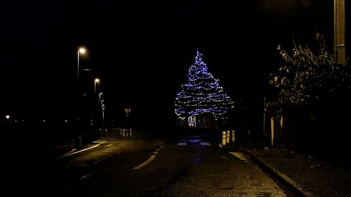 Illuminated street light at night