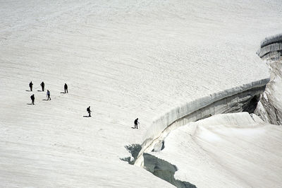 High angle view of people on snow covered mountain