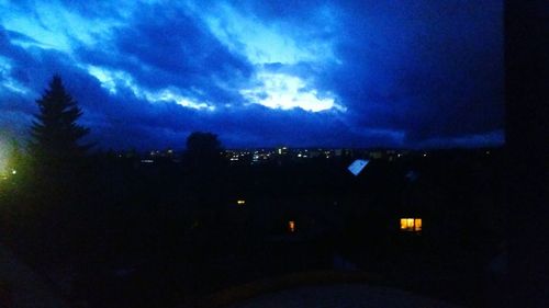 View of illuminated city at night