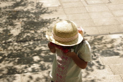 High angle view of girl on footpath