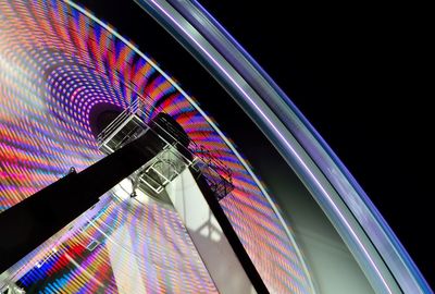 Low angle view of illuminated ferris wheel