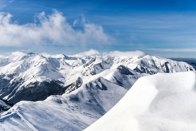 Scenic view of snowcapped mountains against sky