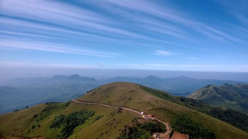 High angle view of mountains against blue sky