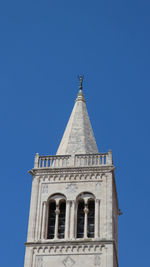 Low angle view of bell tower against clear blue sky in zadar croatia 